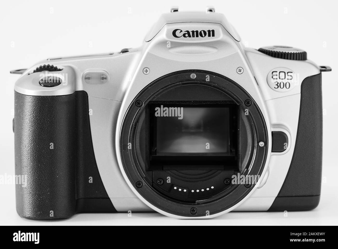 Front view of a Canon Eos 300 camera without lens, visible mirror, analog reflex system. Stock Photo
