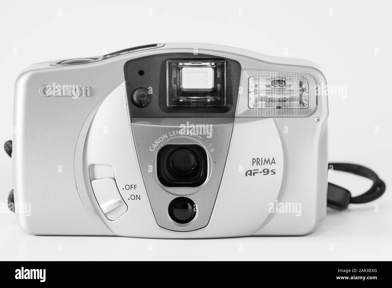 Front view of a compact analog camera, 35mm system, Canon brand, 'Af9 Prima' model, monochrome image. Stock Photo