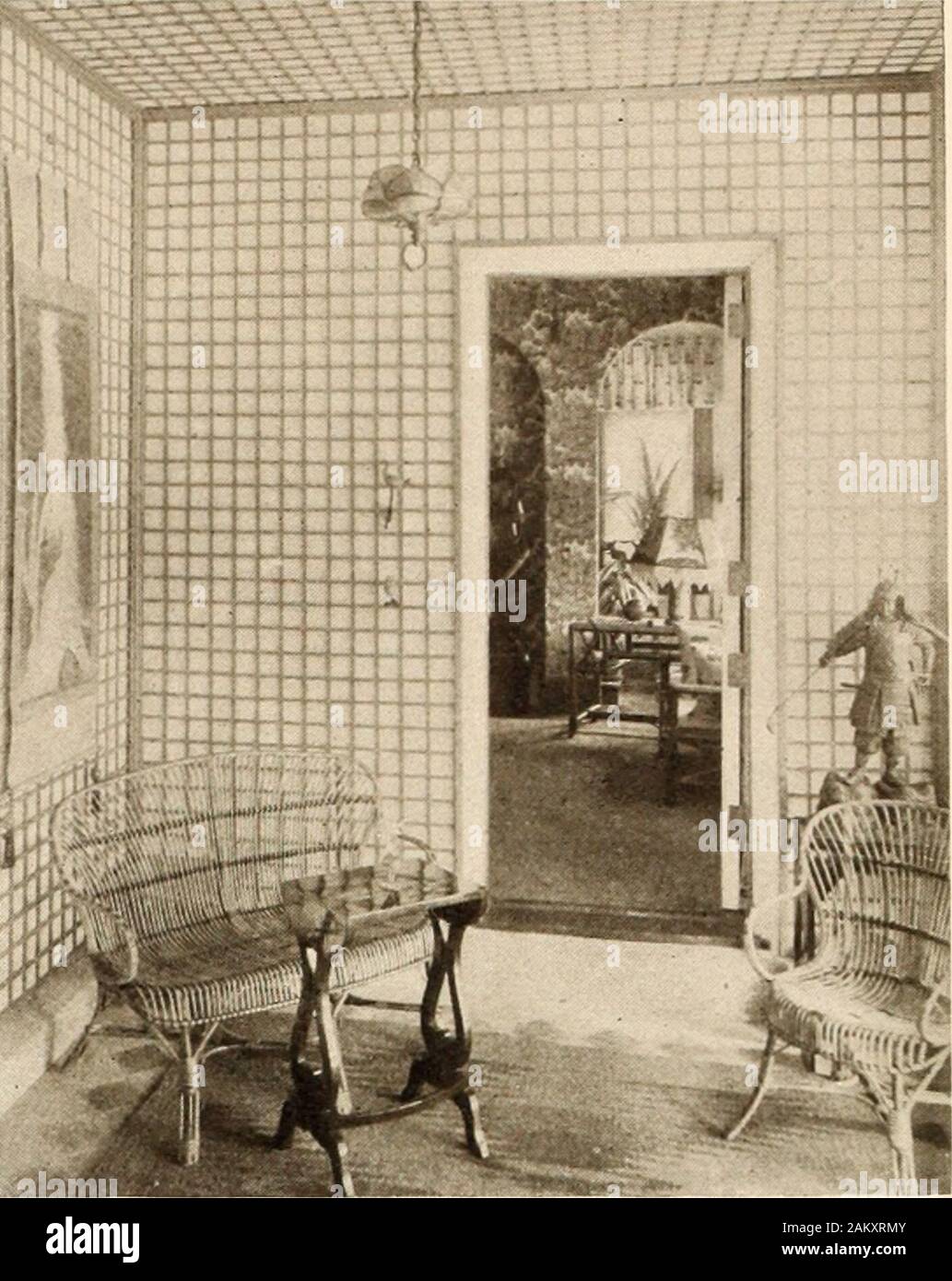 American homes and gardens . The Sun Room Furnished in Japanese Style A Corner in the Enclosed Porch steps leading to the enclosed yard arranged below.The terrace or inner front of the house displays quitedifferent characteristics from those which obtain on the en-trance front. The latter front being directly on the levelwith the ground, necessarily seems low. The terrace front,on the contrary, is loftily elevated, owing to the steep slopeof the ground. The symmetry which Mr. Eyre discarded onthe entrance front is more apparent here. The whole ofthe center is occupied by a great stone terrace, Stock Photo