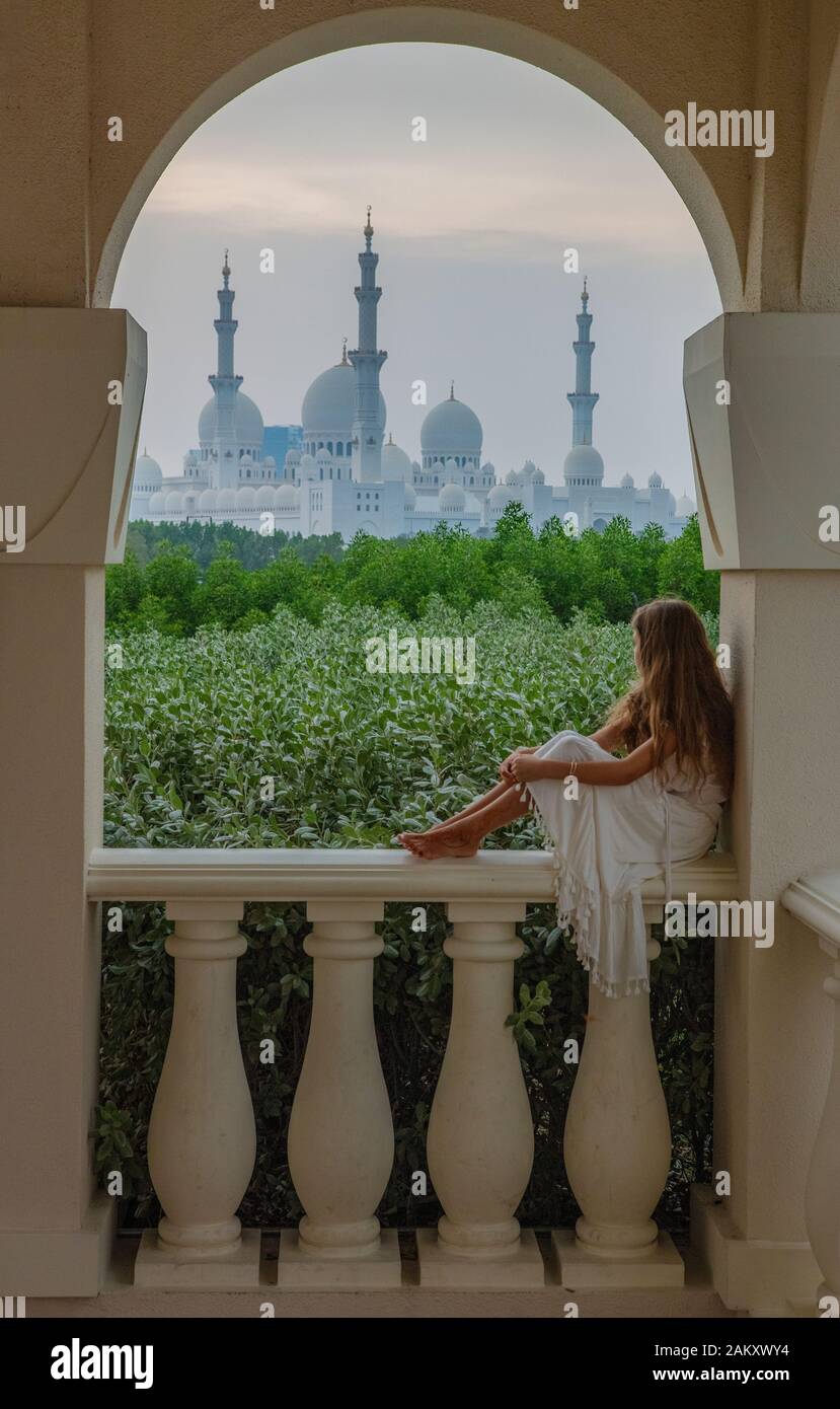 Girl looking at the Sheikh Zayed Grand Mosque in Abu Dhabi. Stock Photo