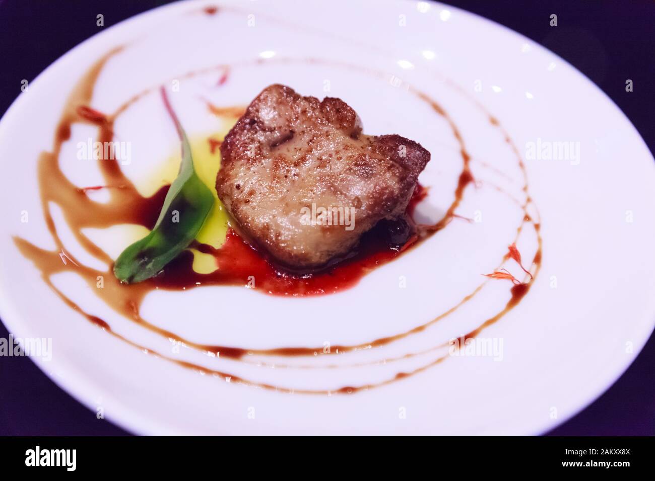 Delicious fresh sliced, pan seared Foie Gras with berry sauce 