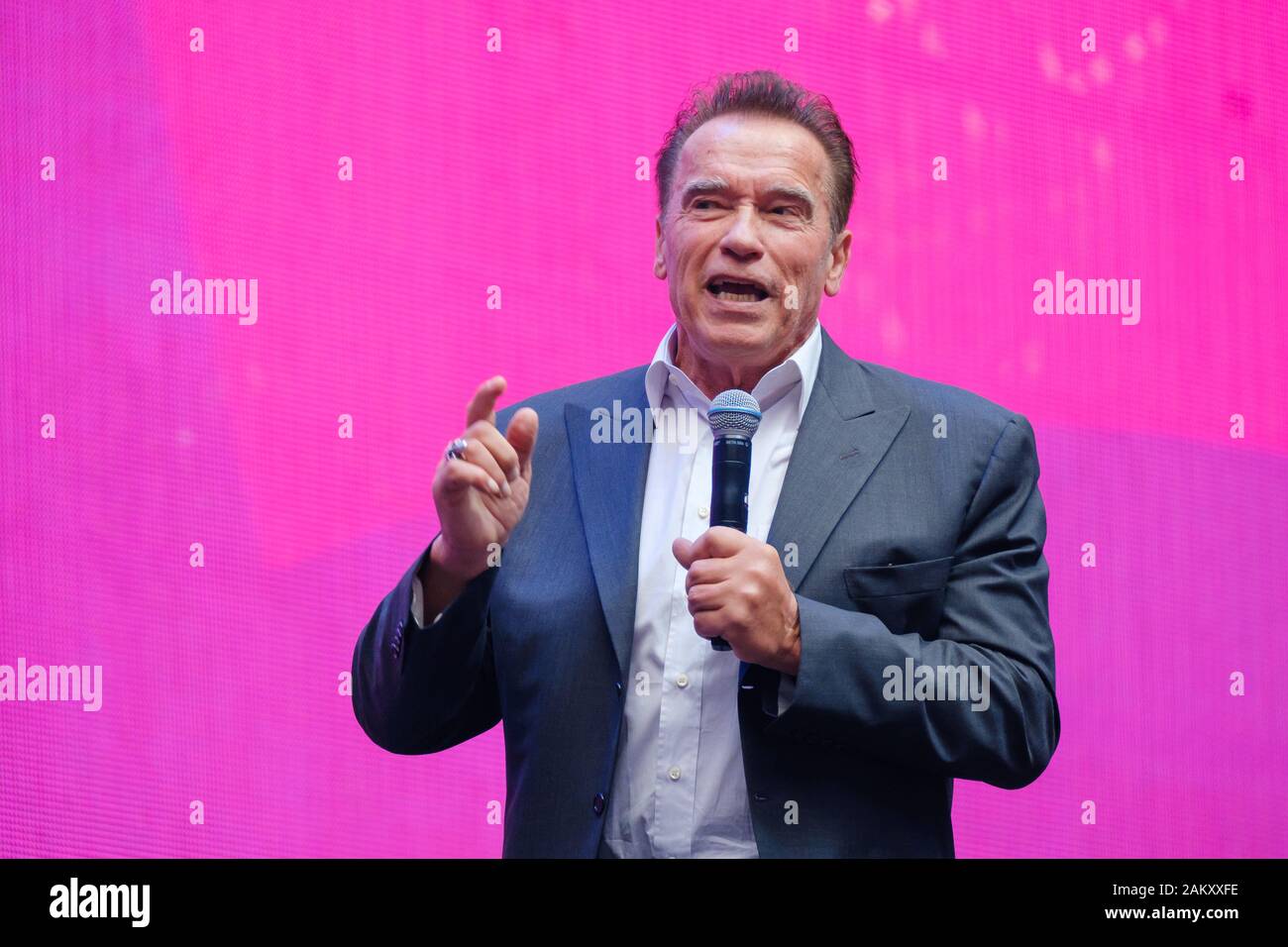 Arnold Schwarzenegger, famous actor, politician and businessman, speaks at a business forum Stock Photo