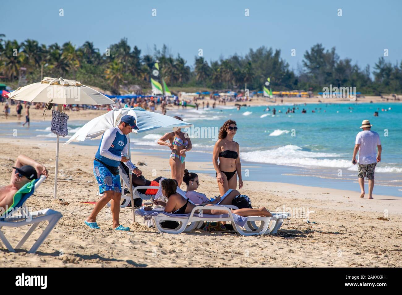 People enjoying the sun at Santa Maria del Mar beach , Havana, Cuba Stock Photo