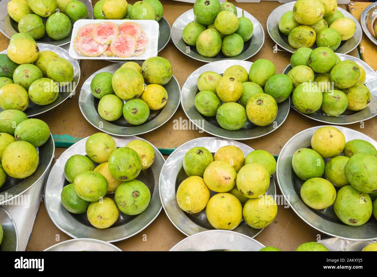 Slice cut of red guava and whole fruits at Singapore local market Stock ...