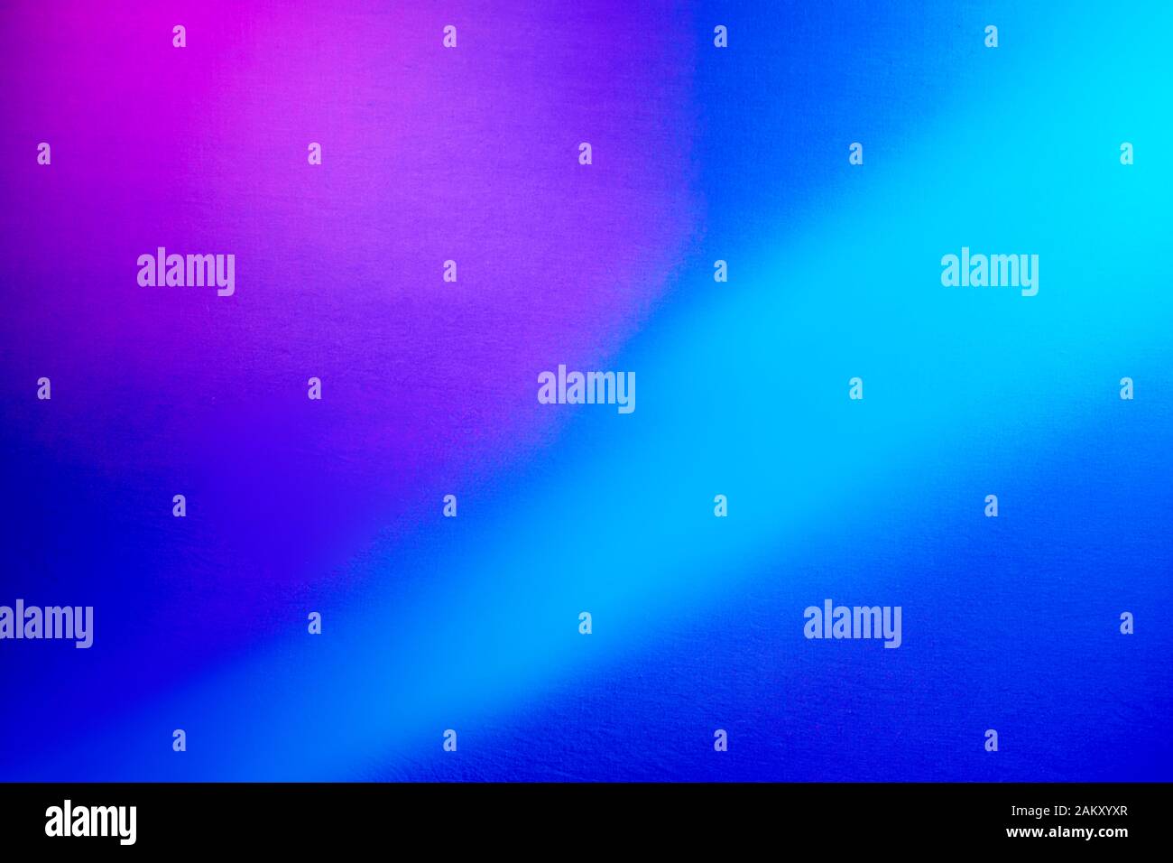 Light blue beam on blue background and pink spot Stock Photo Alamy