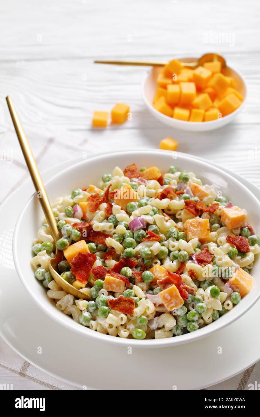 delicious elbow macaroni salad with green peas, fried crispy bacon