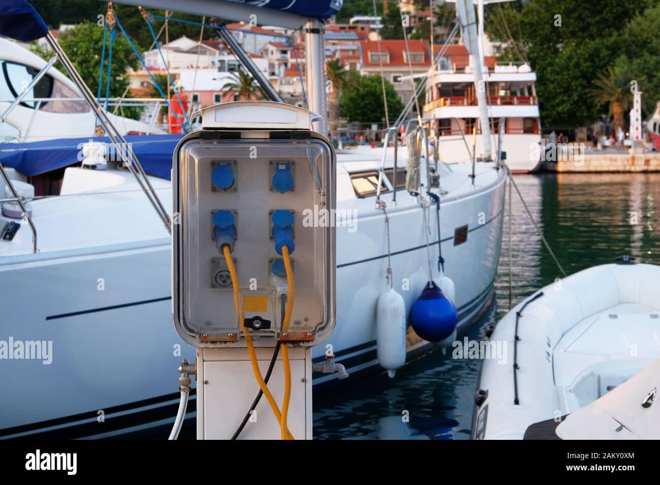 Electrical outlets for charging on boats in sea coast in Mediterranean