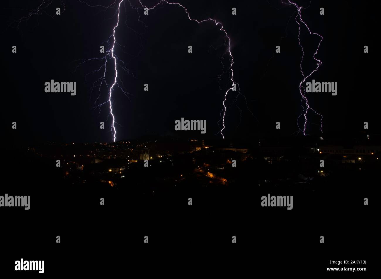 Incredible bright lightning strikes in historic city centre of Ouro