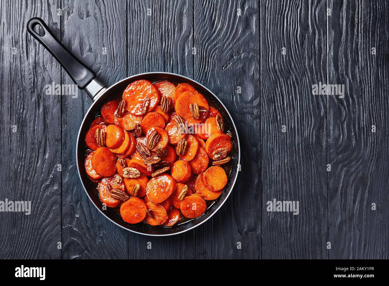 Candied sweet potatoes with brown sugar, maple syrup, orange juice and