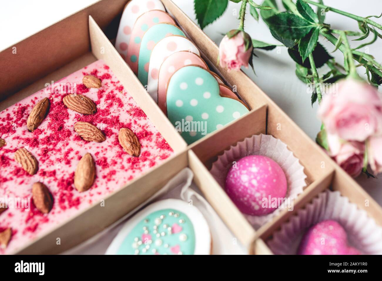 Gift set with hand made sweets in a box on a white table. Stock Photo