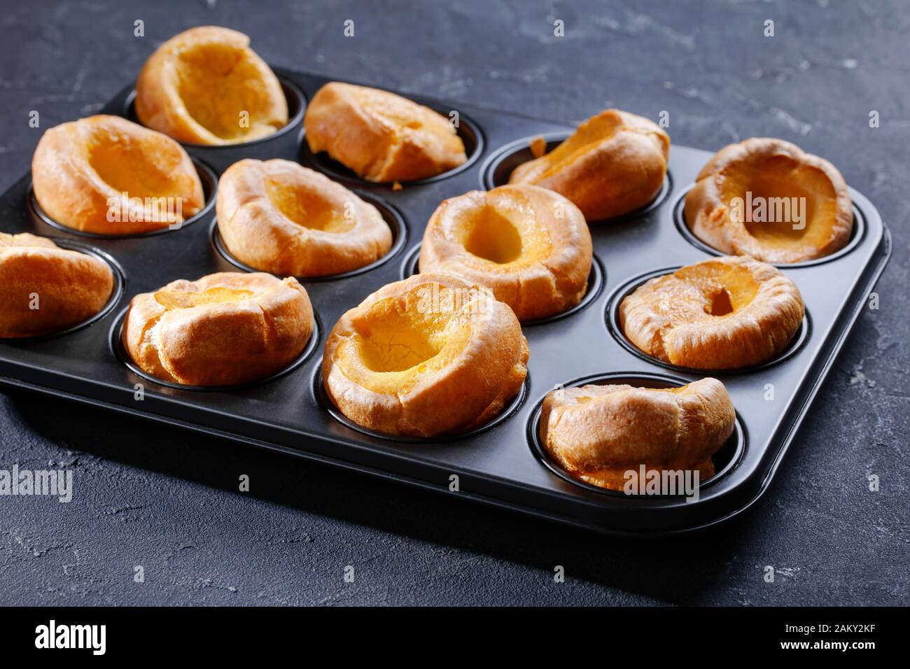 close-up of traditional Yorkshire puddings in a baking tray on a concrete table, english cuisine, view from above Stock Photo