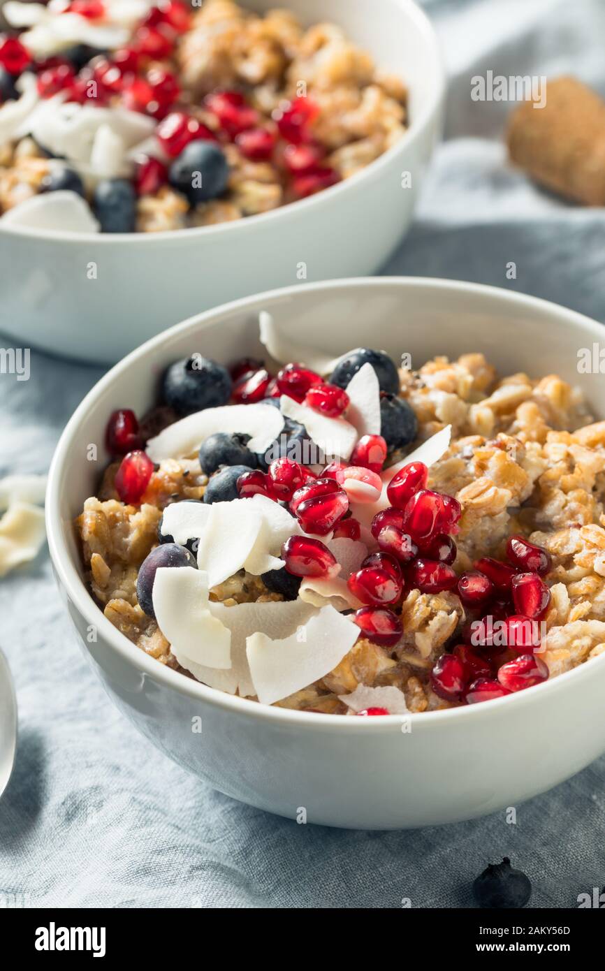 Hot Cooked Muesli Oatmeal with Berries and Coconut Stock Photo