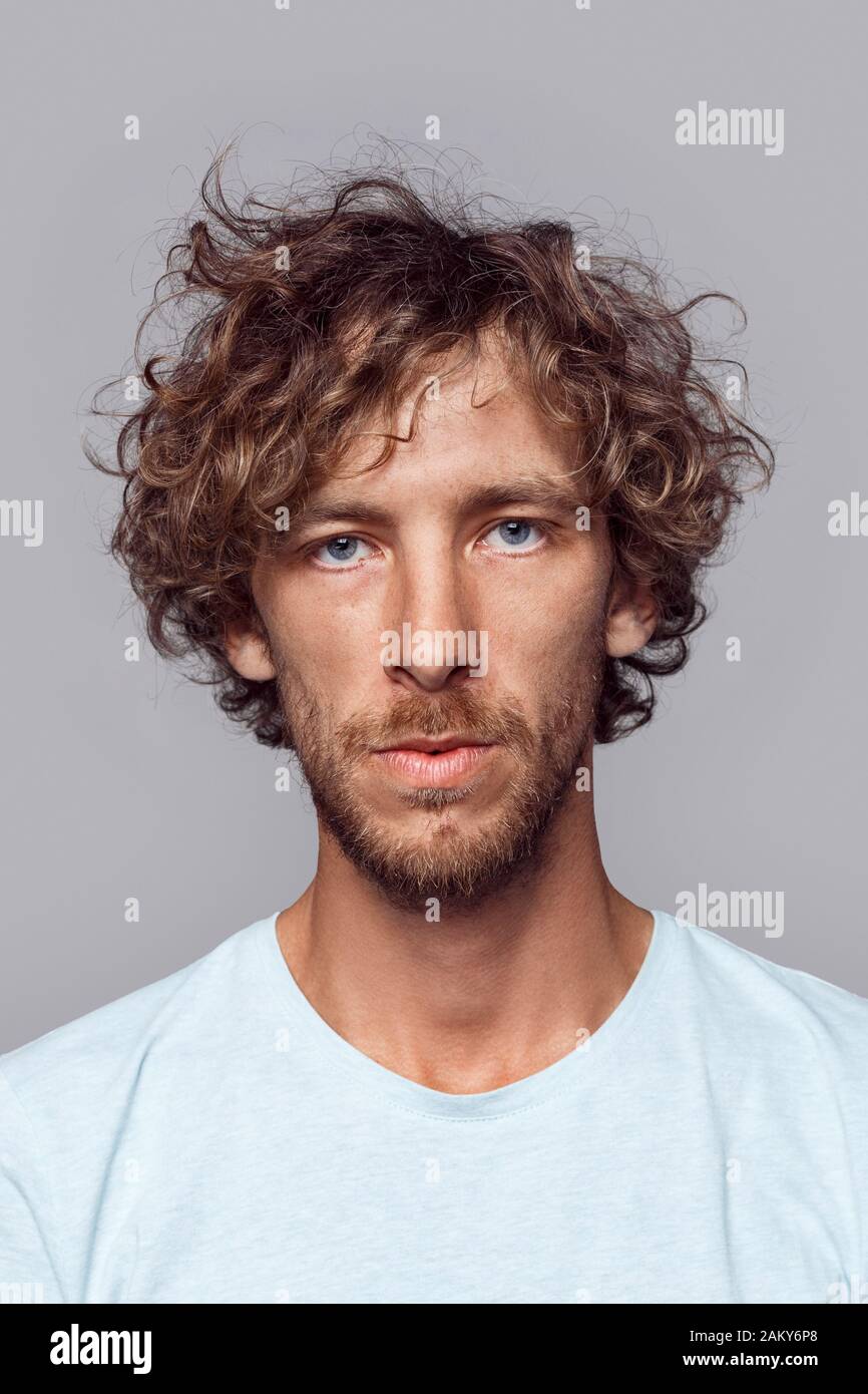 Freestyle Man With Curly Hair In T Shirt Standing Isolated On Grey Serious Close Up Stock Photo Alamy,Jewellery Diamond Long Necklace Indian Designs