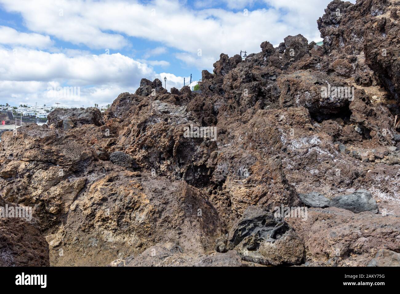 Big lava rocks on the coastline of Puerto del Carmen at Canary island ...