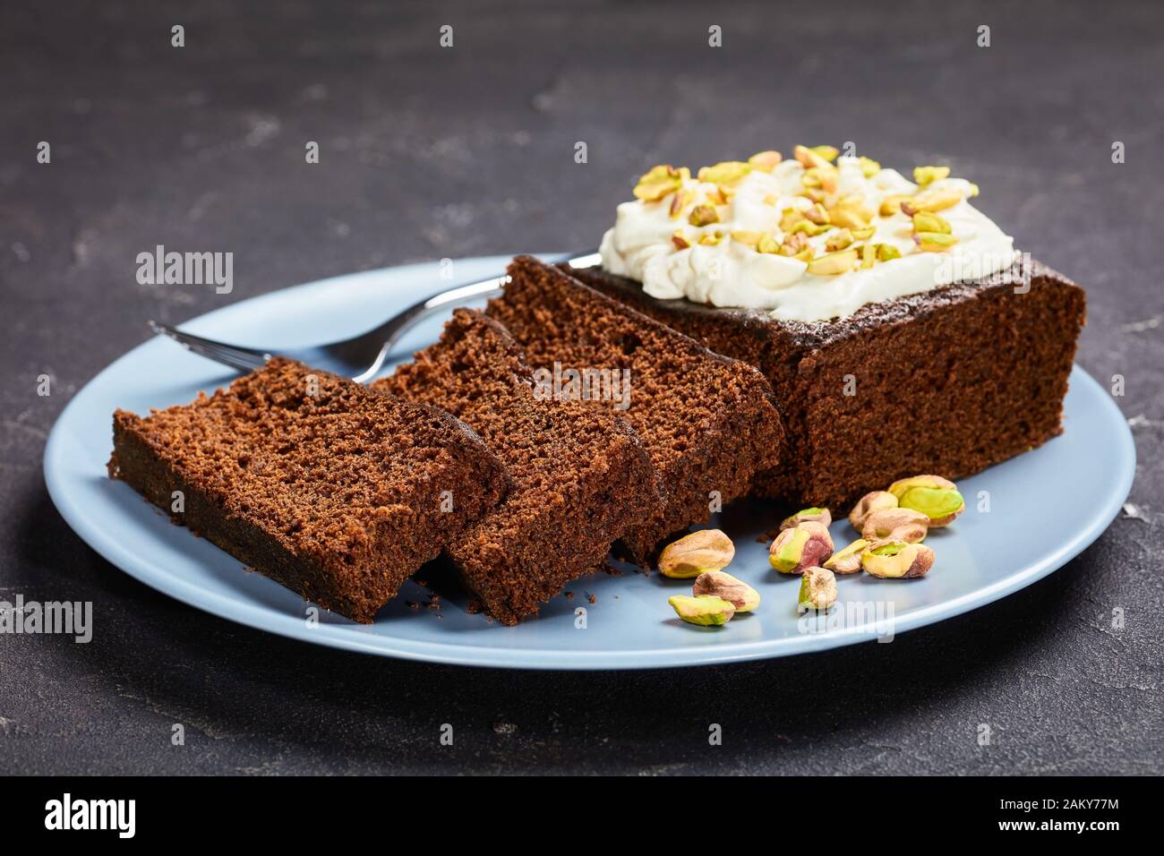 Dark Molasses Gingerbread Cake with fresh whipped cream on top and