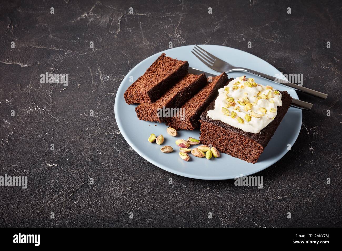 Dark Molasses Gingerbread Cake with fresh whipped cream on top and