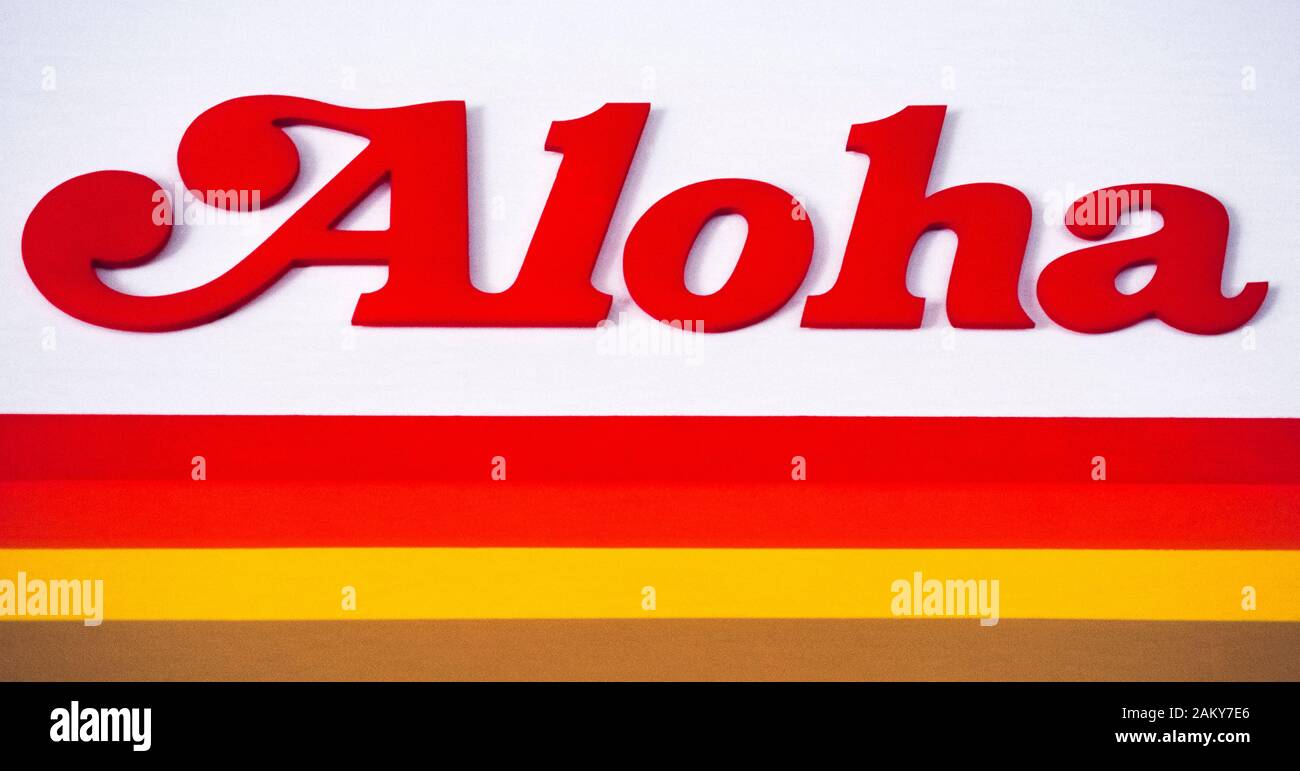 'Aloha' is a well-known Hawaiian word that is used when greeting someone and also when saying farewell. Although its general use is to say both hello and good-bye, Hawaiians use Aloha as an expression of love and affection. In fact, many Hawaiians consider Aloha a way of life rather than just a word. As for the word itself, the literal translation of Aloha from Hawaiian to English is “the presence of breath;” “Alo” is a Hawaiian word for presence and “ha” means breath. The Aloha sign shown here is an early logo of a major Hawaiian air carrier, Aloha Airlines, which operated from 1946 to 2008. Stock Photo