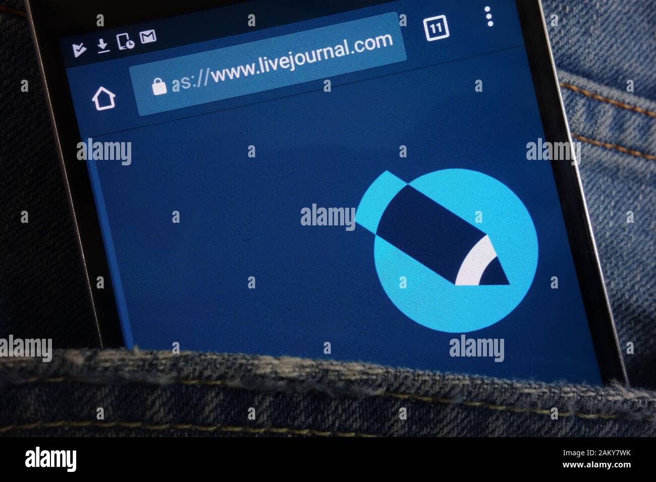 LiveJournal website displayed on smartphone hidden in jeans pocket Stock Photo
