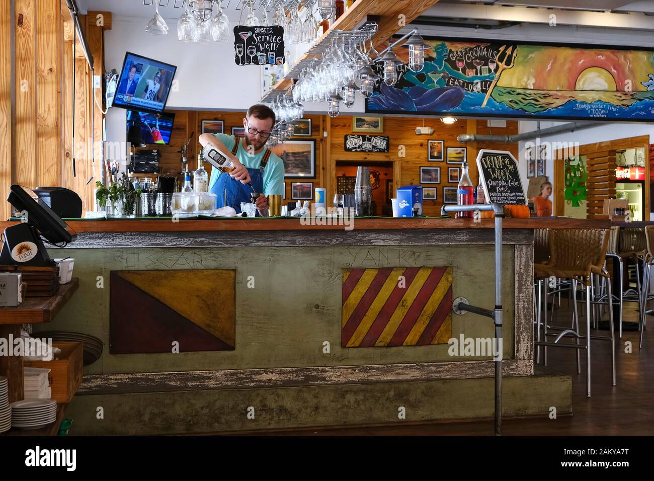 Bartender pouring a mixed alcoholic drink using Jack Daniel's bourbon whisky in restaurant / bar in Fairhope Alabama, United States. Stock Photo