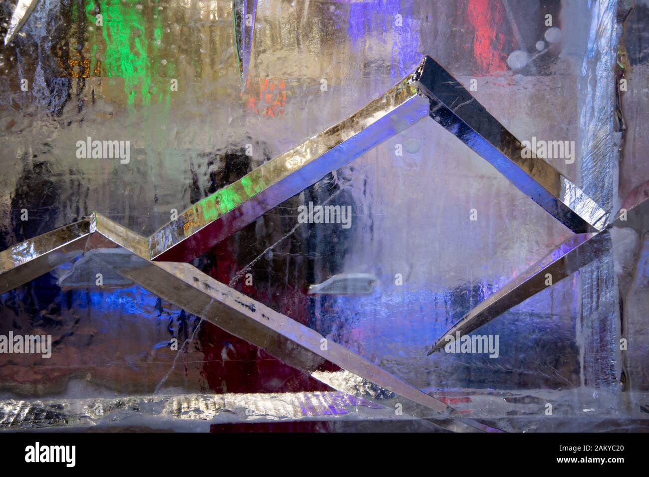 Background with transparent multicolored ice Stock Photo
