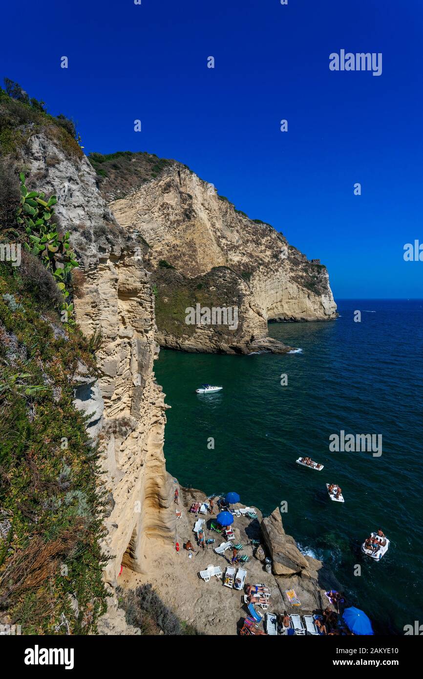 Small Bay and Beach on the rocks in  Capo Miseno, Baia, Phlegrean Fields, Gulf of Naples, Campania, Italy Stock Photo