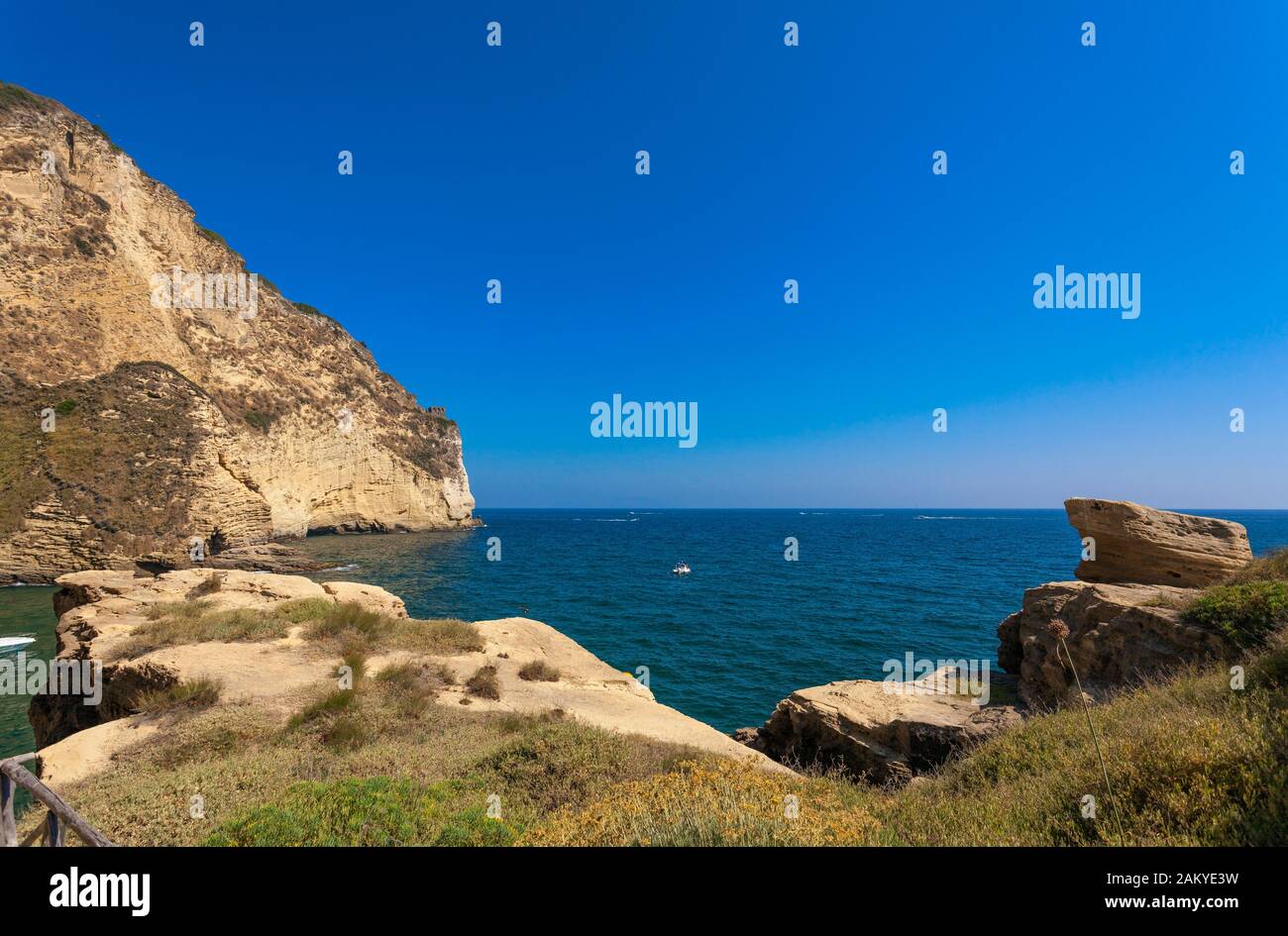 Small Bay and Beach on the rocks in  Capo Miseno, Baia, Phlegrean Fields, Gulf of Naples, Campania, Italy Stock Photo
