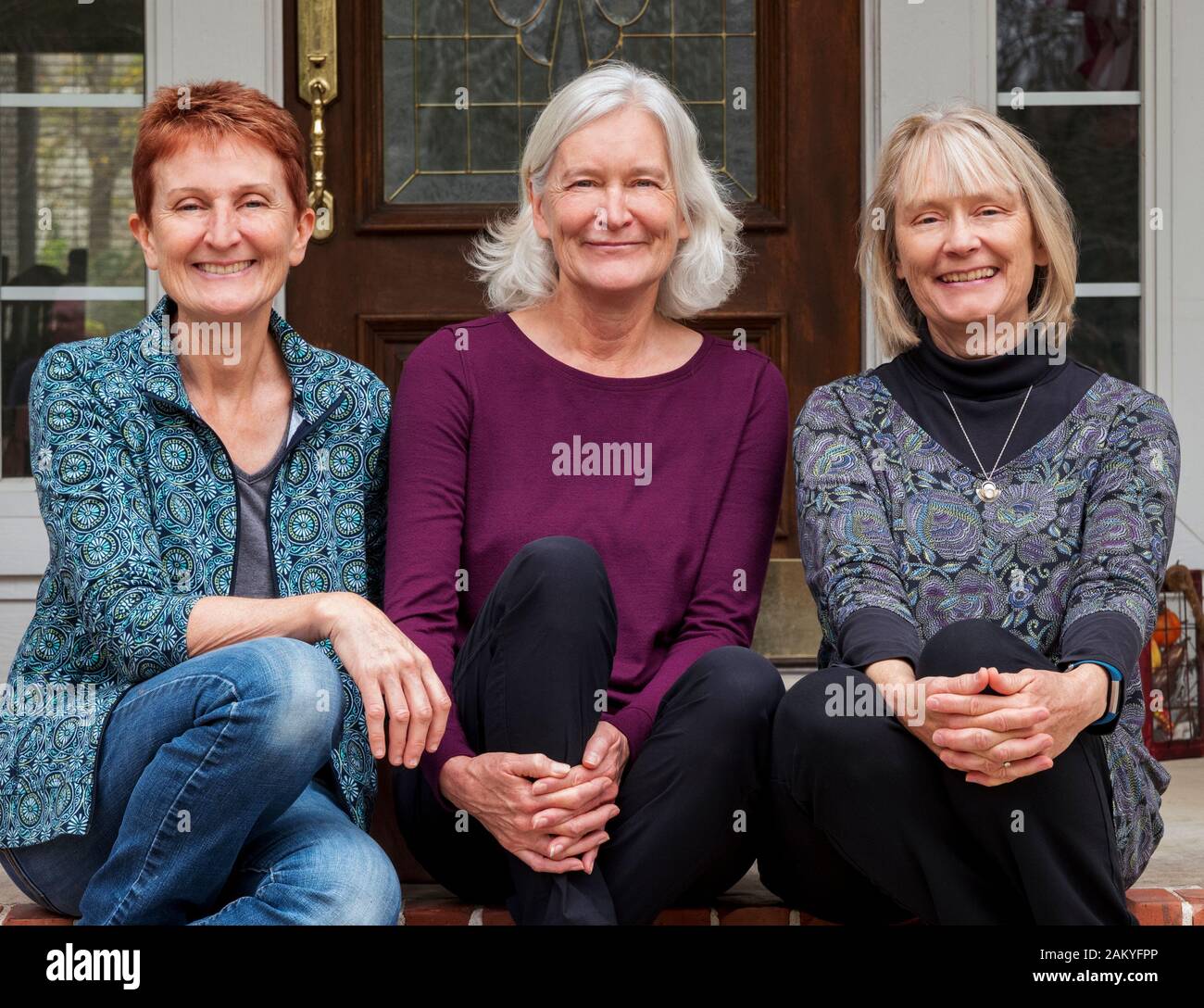 Outdoor portrait of three adult sisters Stock Photo
