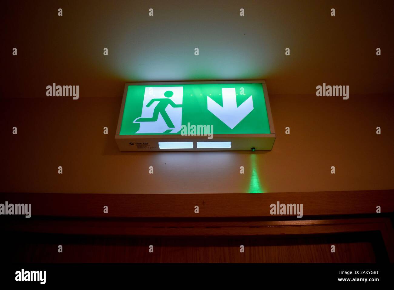 An escape exit sign in a residential apartment building Stock Photo