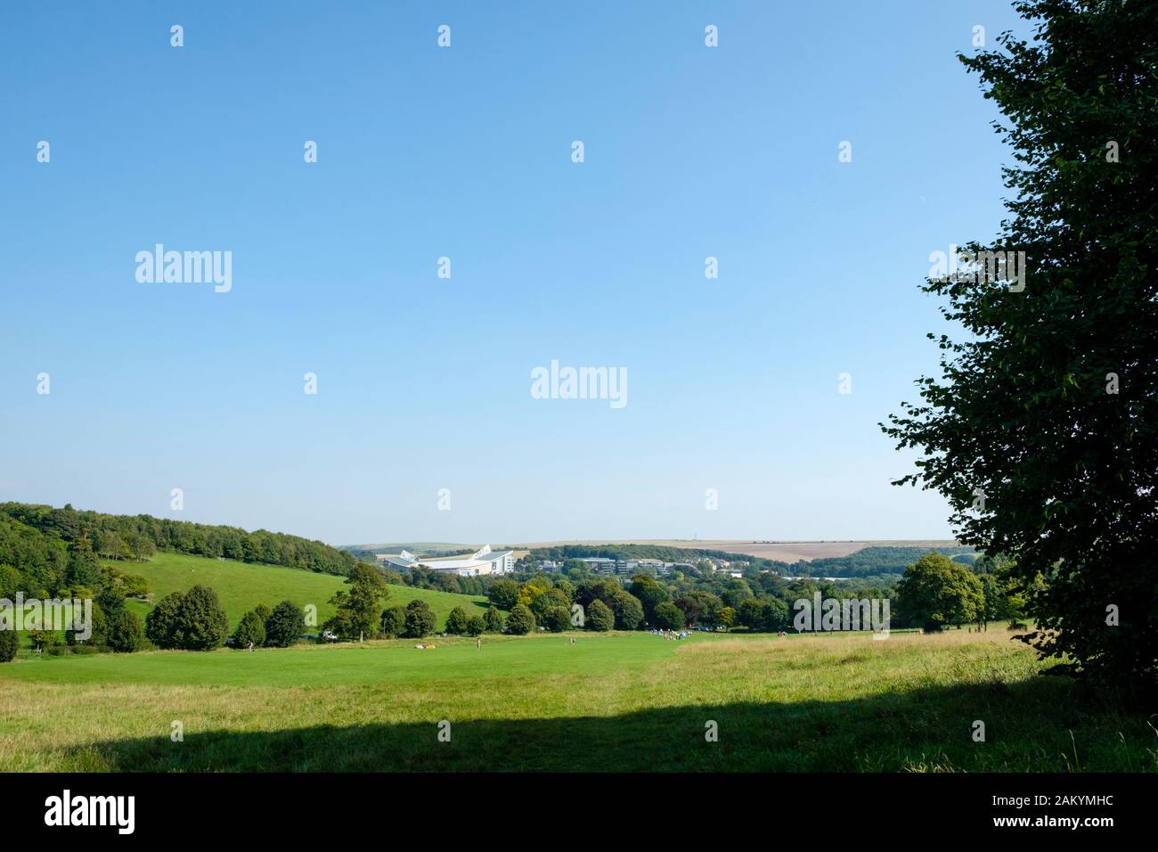 Seen from Stanmer Park the American Express Community Stadium (Amex Stadium) nestles in the South Downs next to Brighton University Falmer Campus Stock Photo