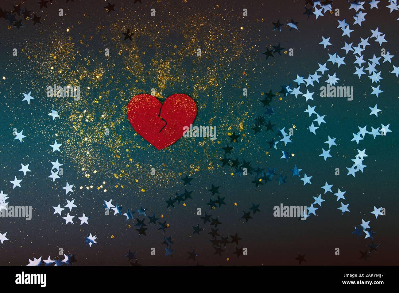 Heart broken on black background - love concept Stock Photo - Alamy