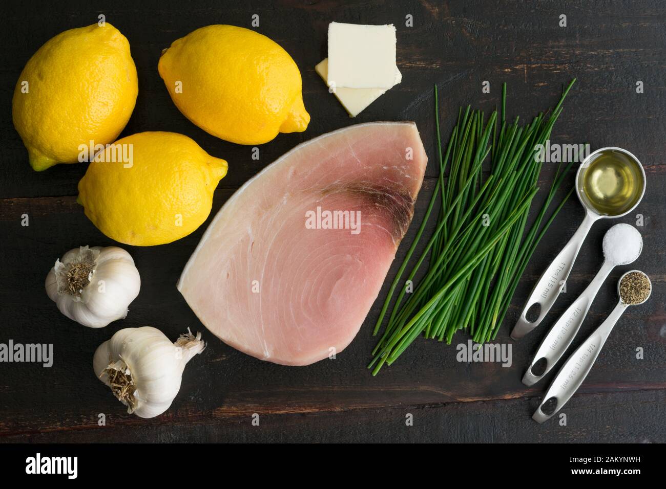 Ingredients for Lemon Garlic Swordfish Swordfish steak, lemons, chives, and other ingredients