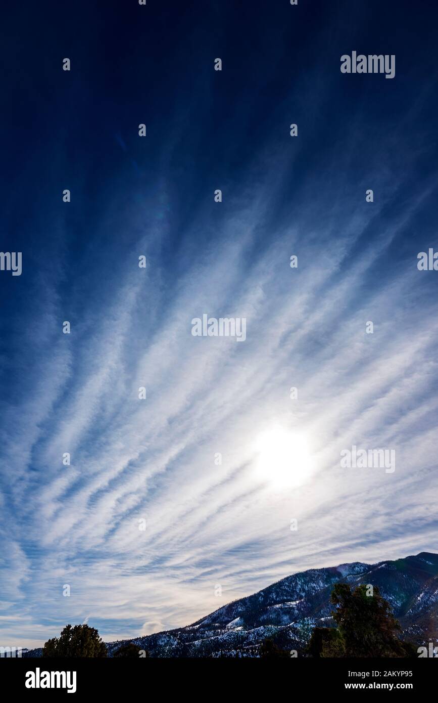 Unusual cloud formations against clear cobalt blue sky; central Colorado; USA Stock Photo
