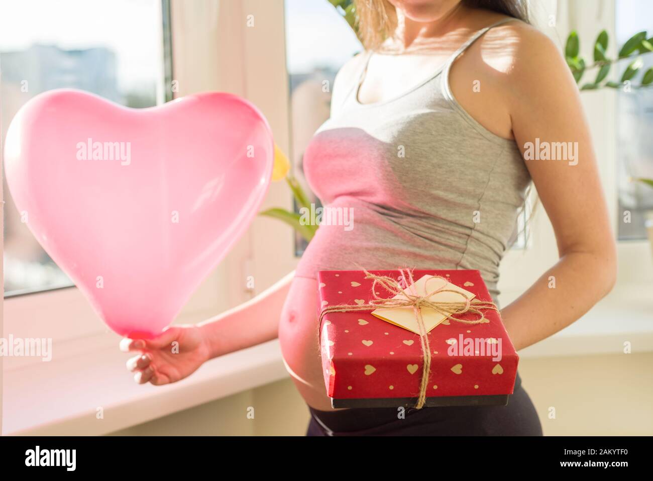 Holiday In The Life Of Young Beautiful Pregnant Woman Happy Female With Valentines Gift Box And Red Heart Balloon Motherhood And Pregnancy Stock Photo Alamy