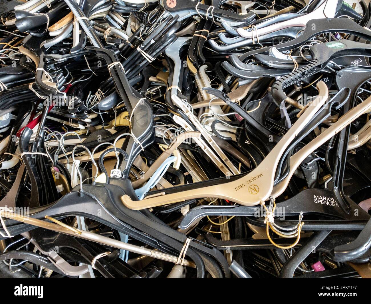 Piles of plastic coat hangers in a waste recycling bin, UK Stock Photo -  Alamy
