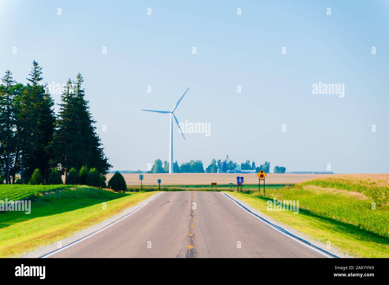 Large wind turbine in a corn field at the end of a road in Dexter Minnesota, USA Stock Photo