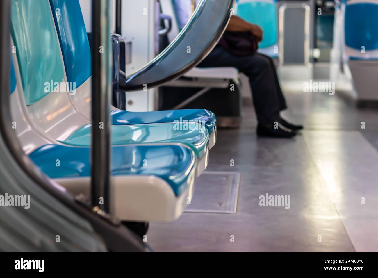 a closeup shoot from a tram with few peoples and empty seats - there is no face can be recognized. photo has taken at izmir/turkey. Stock Photo
