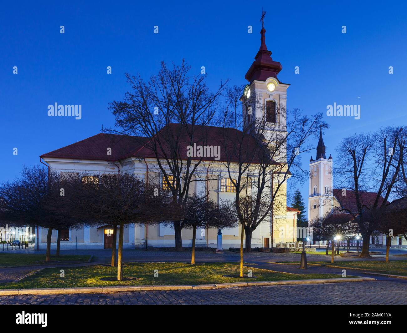 Classicistic Roman Catholic and Calvinist churches in the town of Rimavska Sobota, Slovakia. Stock Photo