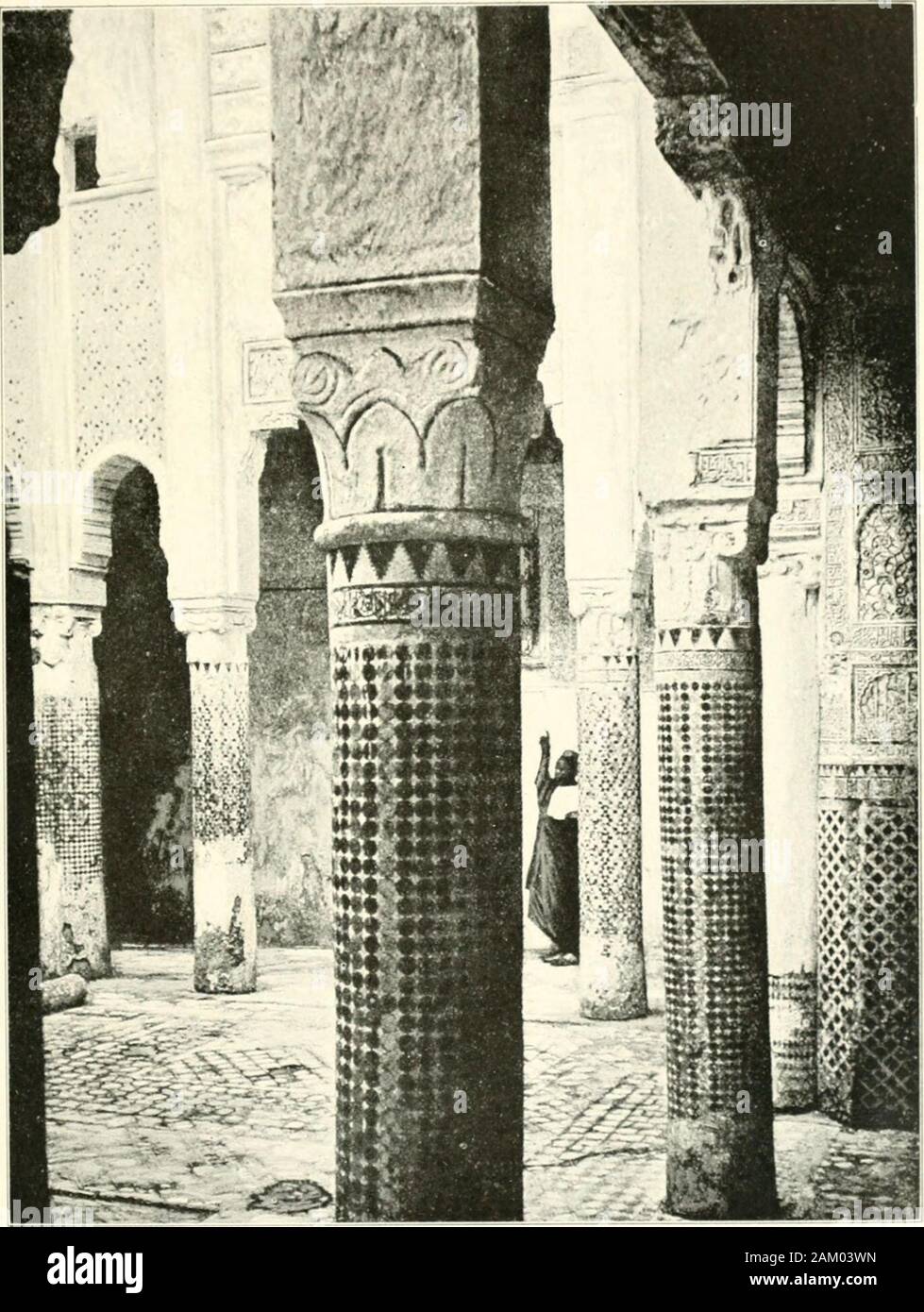 In Morocco . arcaded courtwith a fountain, on one side the long narrow pray-ing-chapel with the mihrab, on the other a class-room with the same ground-plan; and on the nextstory a series of cell-like rooms for the students,opening on carved cedar-wood balconies. Thiscloistered plan, where all the effect is reserved forthe interior fagades about the court, lends itself toa deUcacy of detail that would be inappropriate ona street-front; and the medersas of Fez are end-lessly varied in their fanciful but never exuberantdecoration. M. Tranchant de Lunel has pointed out (inFrance-Maroc) with what a Stock Photo