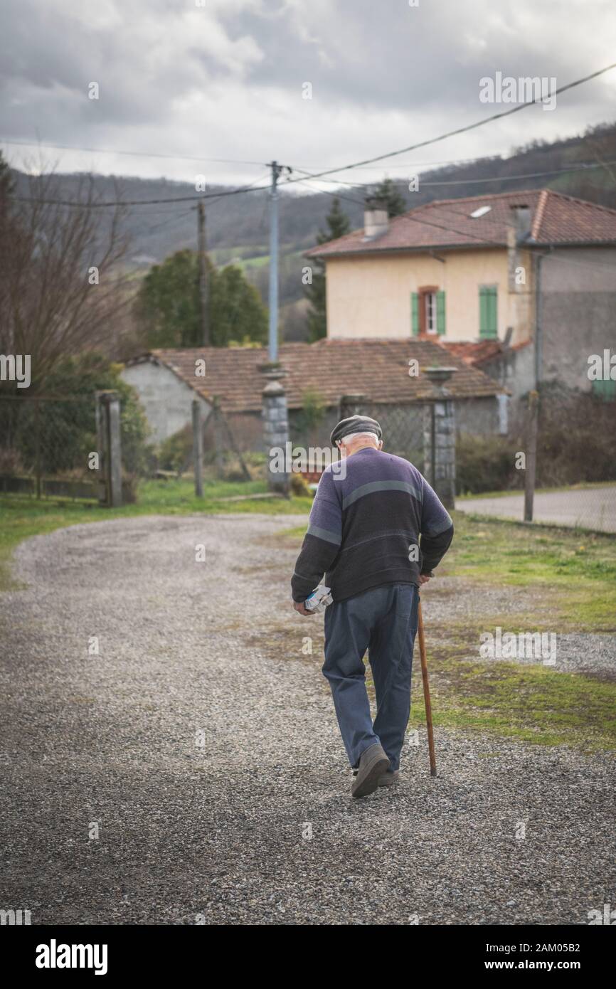 Old man walking with cane hi-res stock photography and images - Alamy
