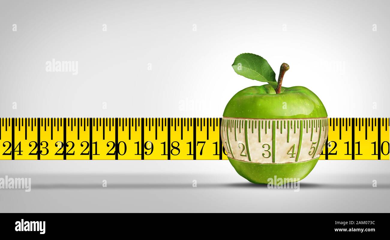 Health and fitness or living a healthy wellness lifestyle as a measuring tape shape carved out of the healthy fruit as a nutrition concept. Stock Photo