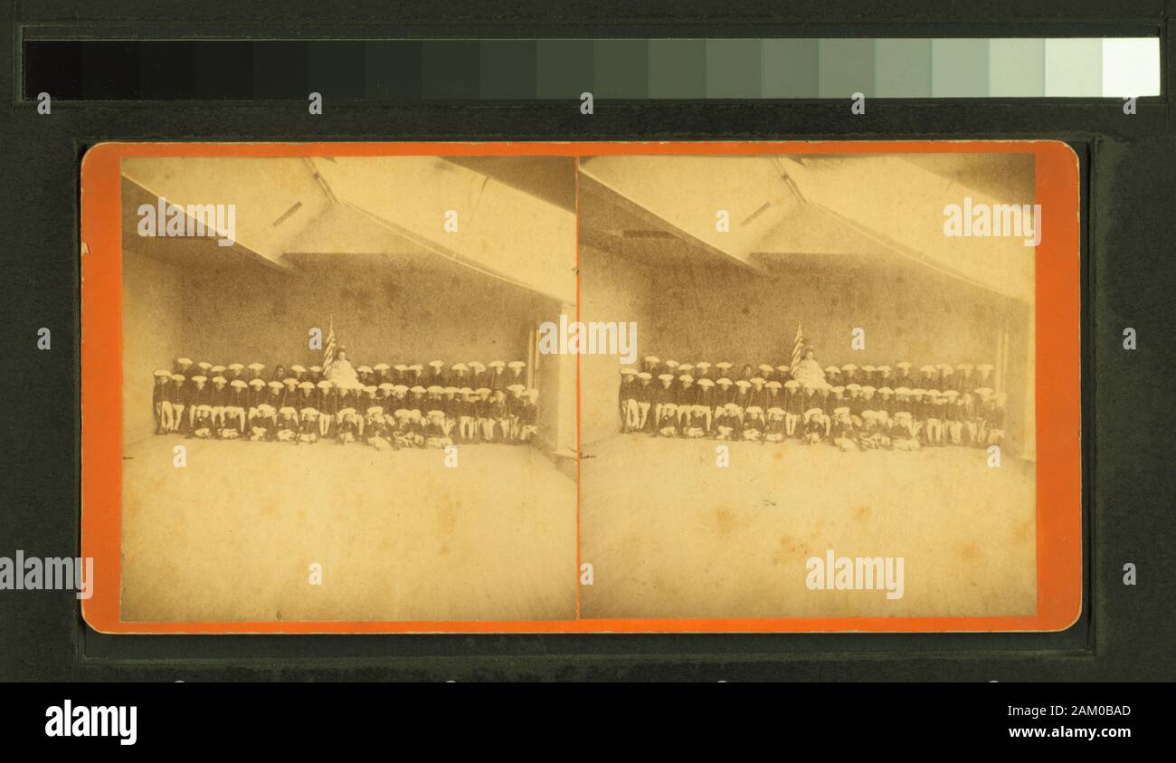 Studio view of 50 children in Revolutionary era outfits  Studio view of 50 children in Revolutionary era outfits.; Studio view of 50 children in Revolutionary era outfits. Stock Photo