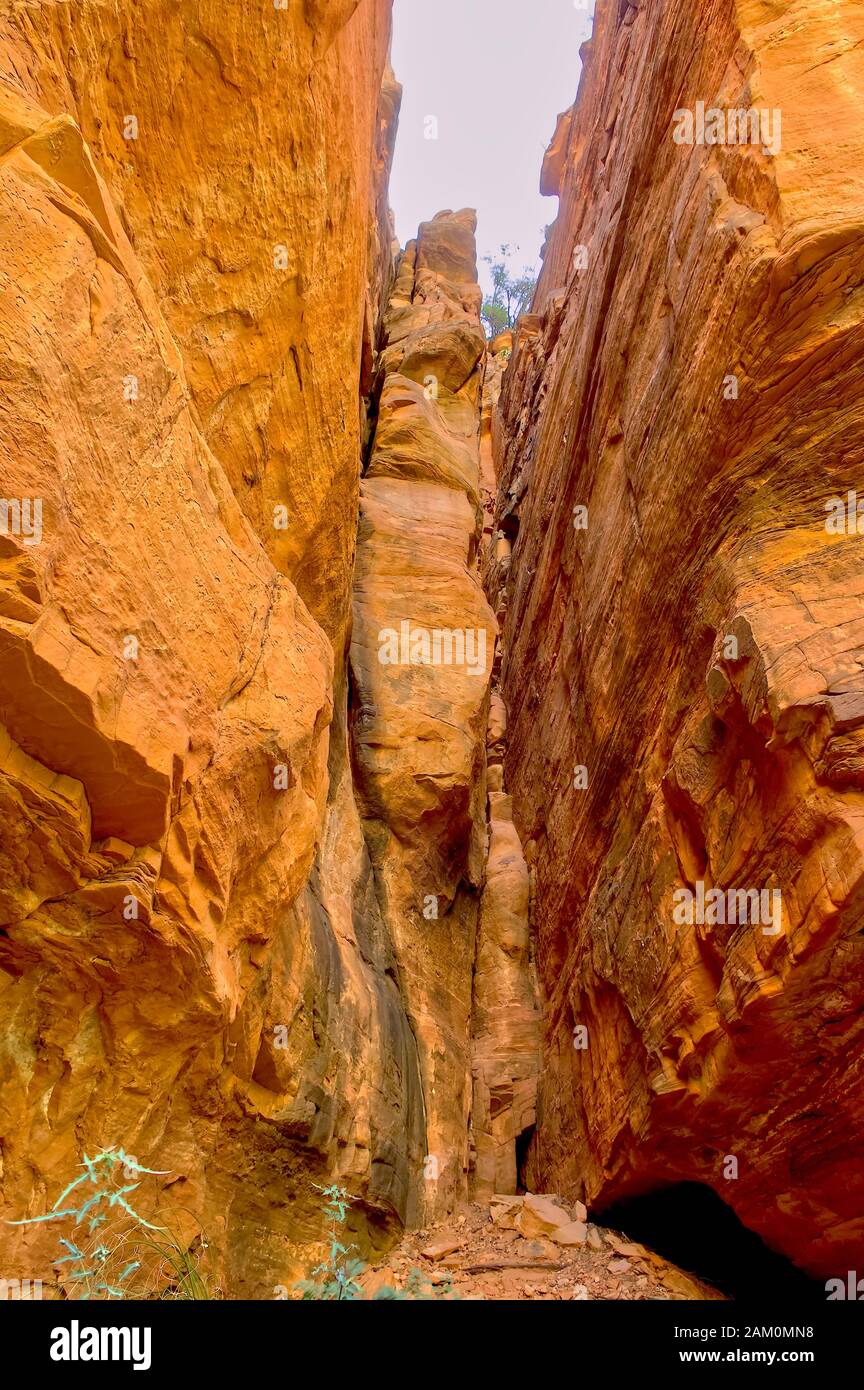 A hidden crevice in Sedona's Fay Canyon where a section of cliff is about to split away from the canyon wall. Stock Photo