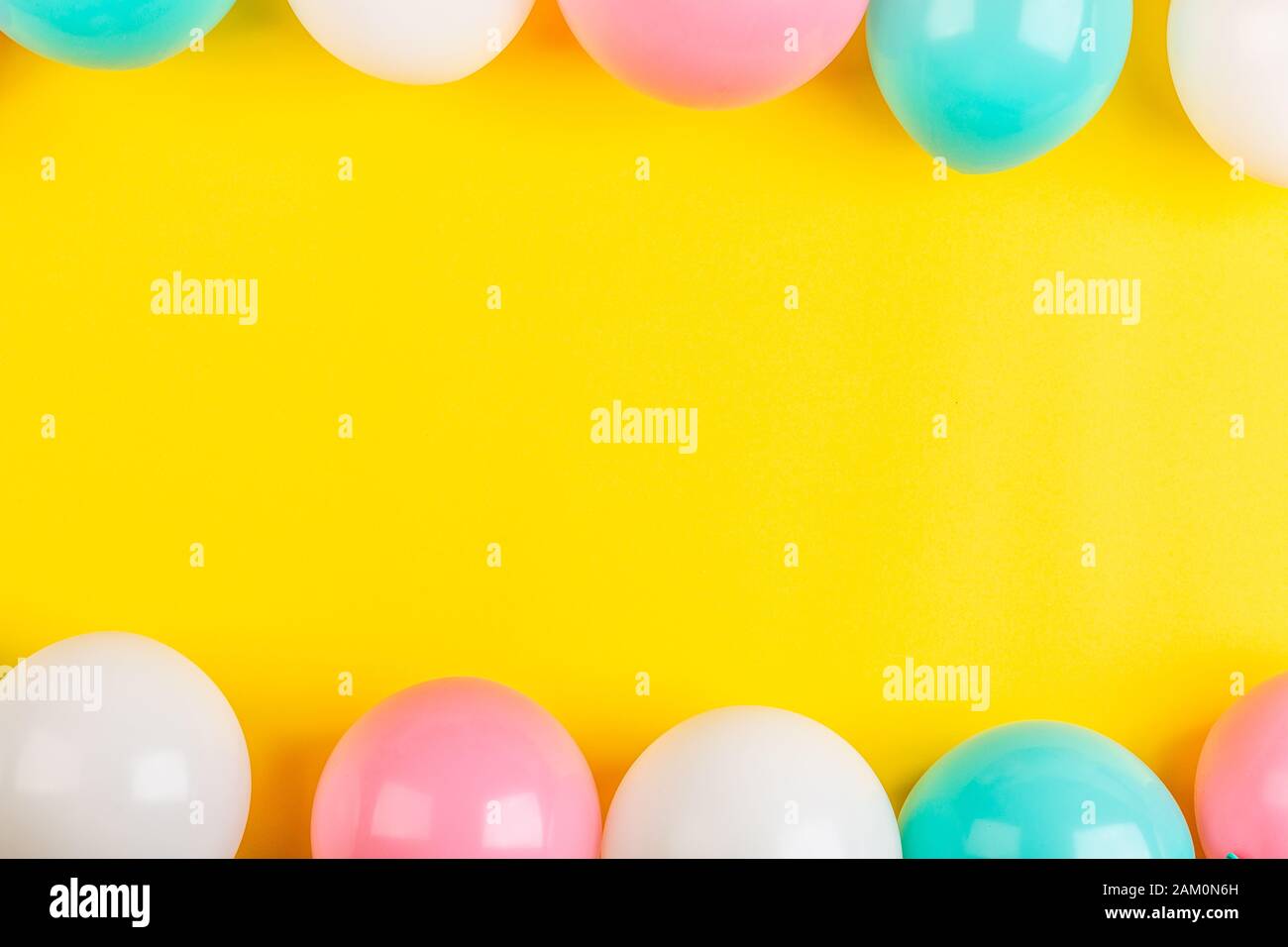 Happy birthday balloons on yellow background, top view. Flat lay ...