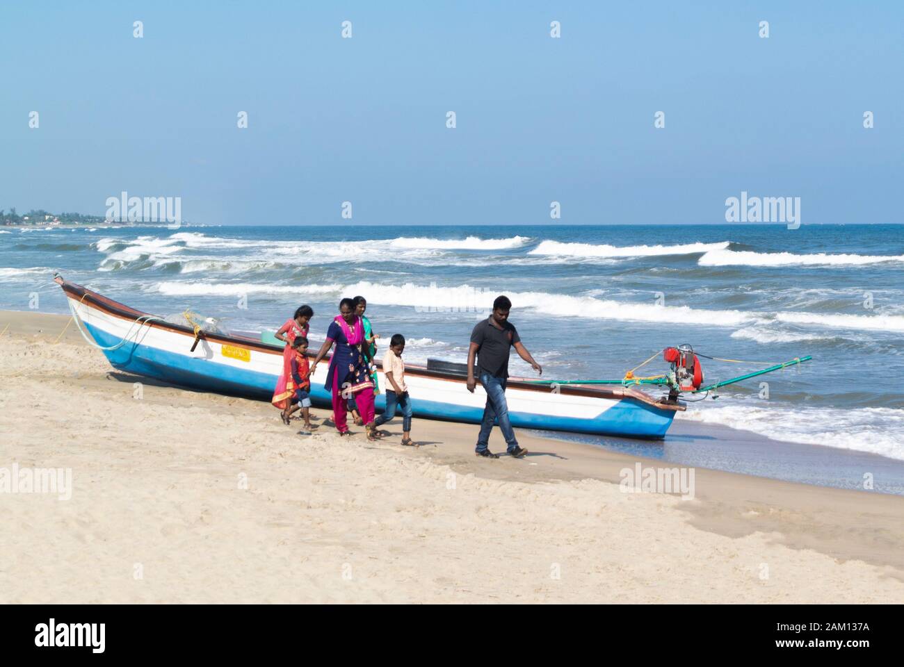 Indian family walking along Mahabalipuram beach, Tamil Nadu, South India,Tamil Nadu, South India Stock Photo