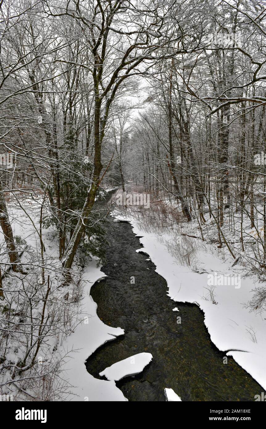Snowy Mill Brook in Cornish, New Hampshire during the winter. Stock Photo