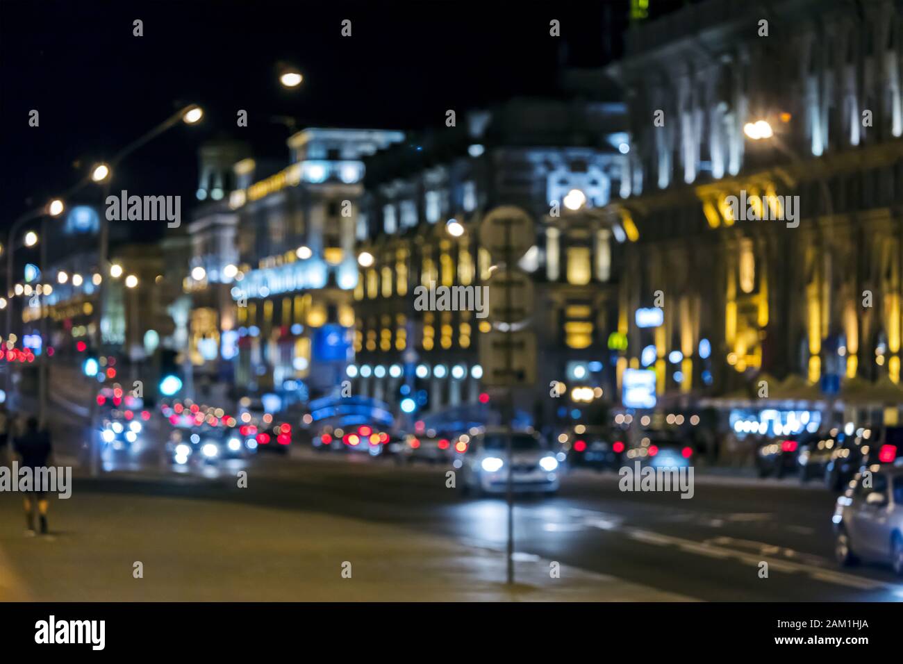 blurred view of night city illuminated with colorful lights. out of focus Stock Photo