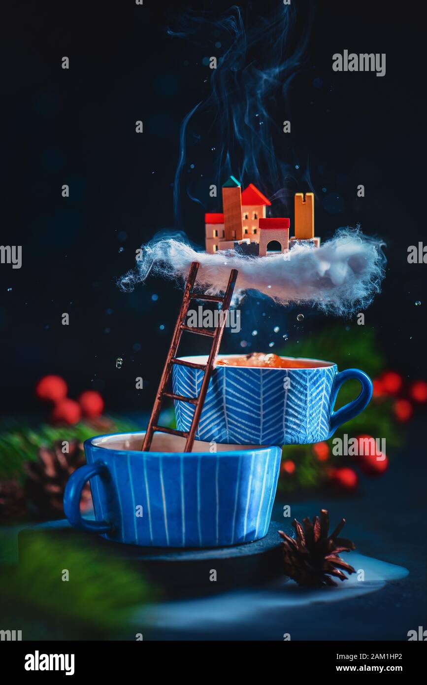 Tiny city on a cloud of tea steam, magical world in creative food photo Stock Photo