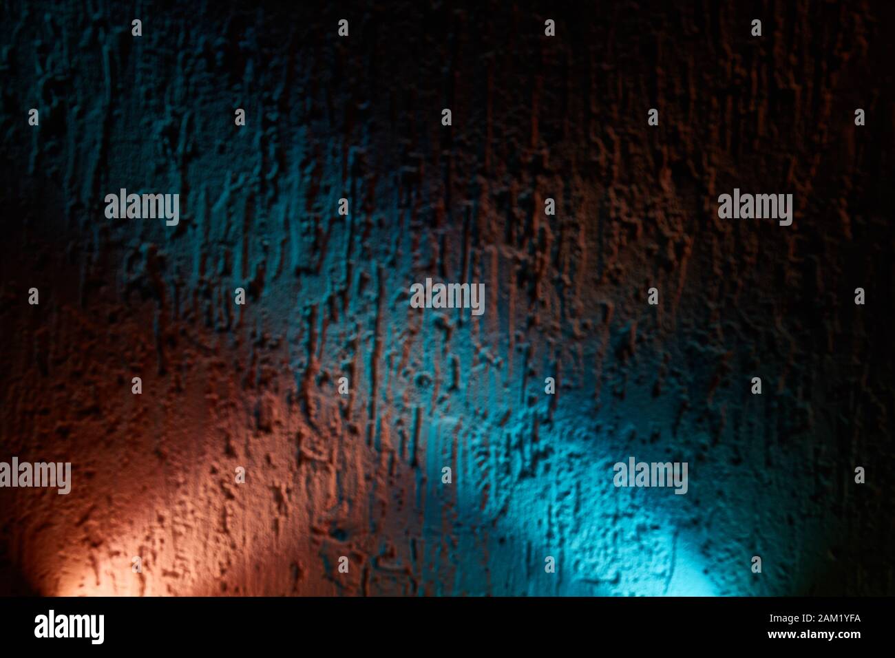 Blue and pink glow overlaps the textural background Stock Photo