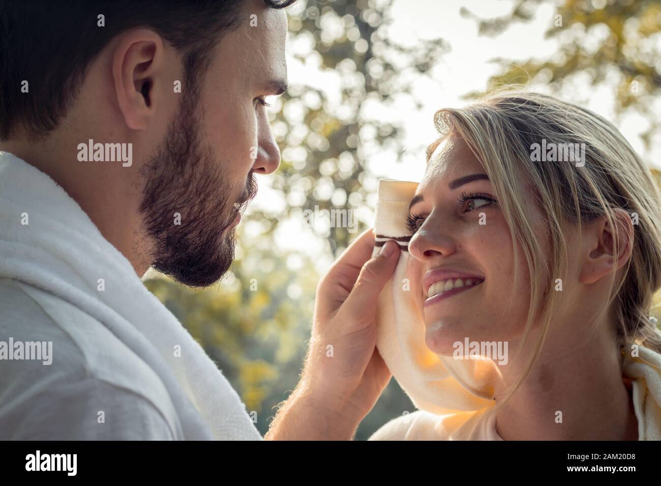 Young man wiped the sweat for his girlfriend after exercising together with  tenderness. Concept couples exercise in the park. Young couples are wiping  Stock Photo - Alamy