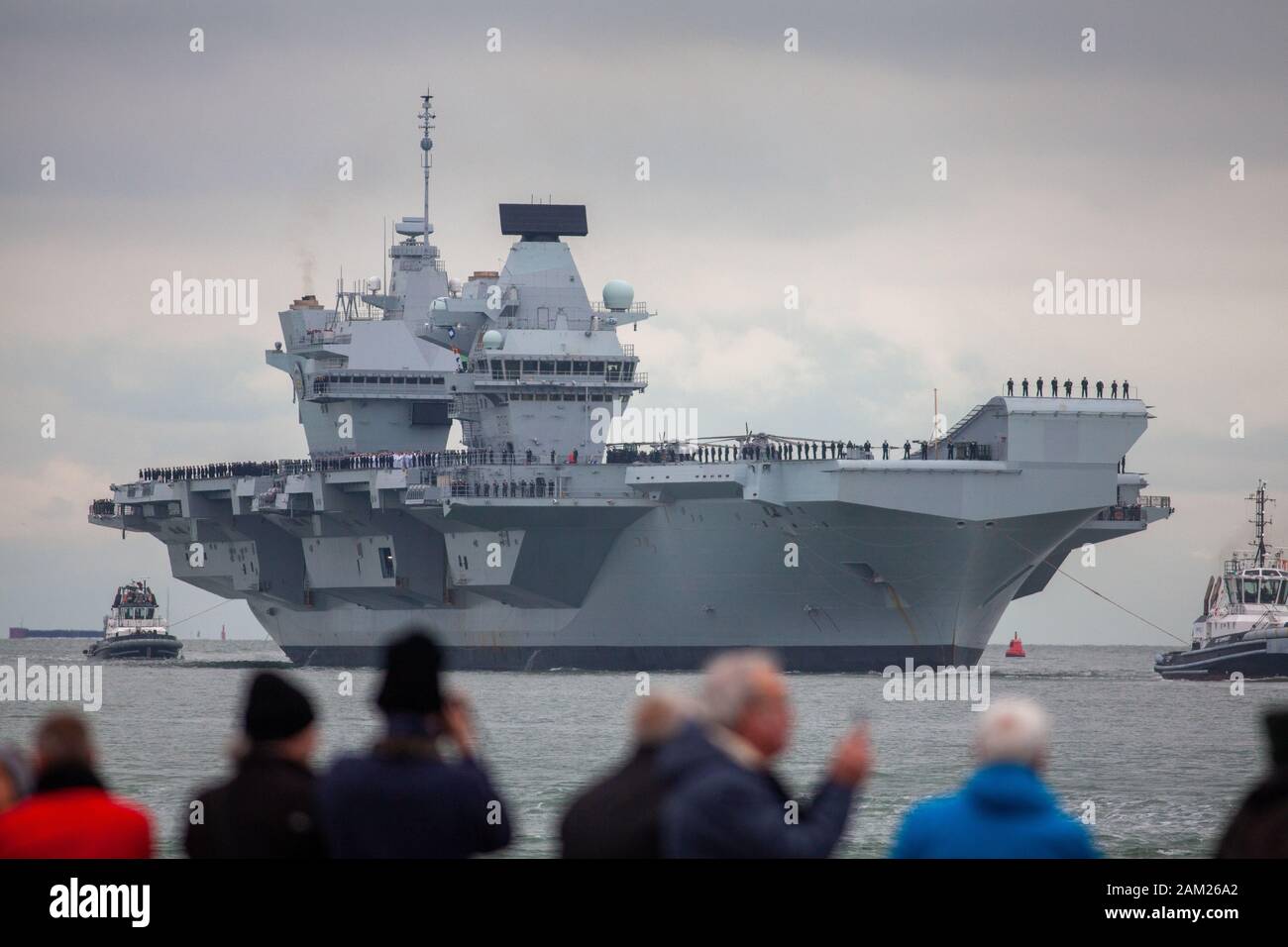 HMS Prince of Wales, the Royal Navy's second Queen Elizabeth-class aircraft carrier, sails into Portsmouth Naval Base for the first time this afternoo Stock Photo